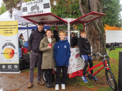 The Fackler Family (Left to Right Colby Fackler, Bronwyn Fackler Quinn Fackler, Trent Fackler) in front of their Cafe Racer Coffee Bike at Riley Park Farmers Market